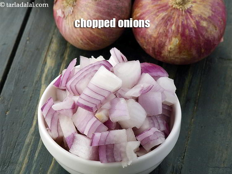 Step 47 – Finely chopped onions can also be added and saut&eacute;ed before adding chawli leaves.&nbsp;