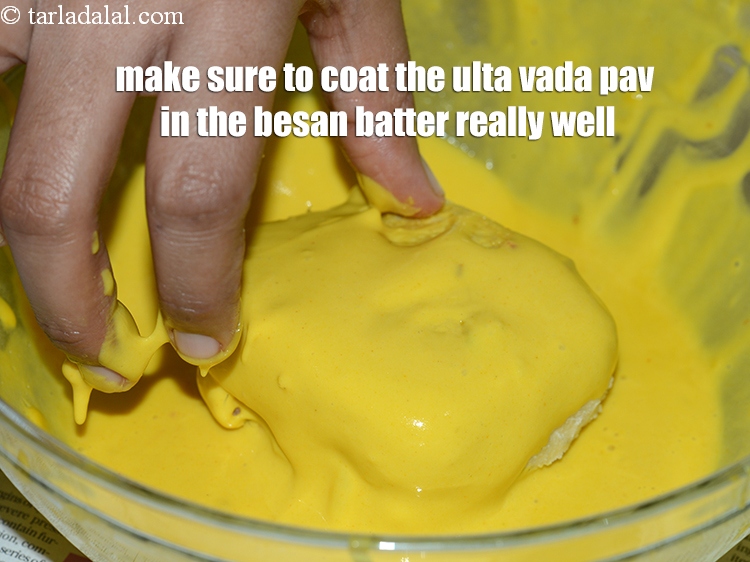 Step 38 – Make sure to coat the ulta vada pav in the besan batter really well.