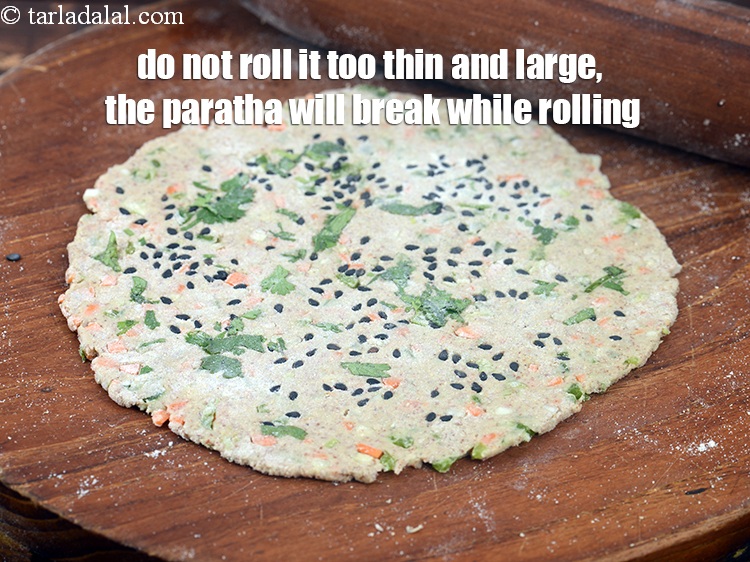 Step 29 – Do not roll it too thin and large, the paratha will break while rolling.<br /> …