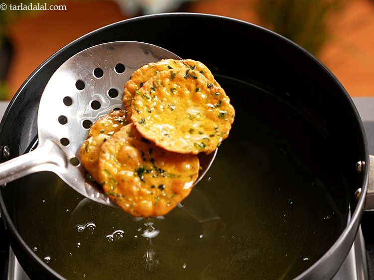 Step 19 – Remove the puris from the oil with a slotted spoon and wait a bit till …