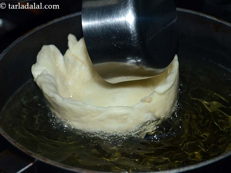 Step 39 – Be careful while frying the katori, it will loossen the sides, then remove the vati …