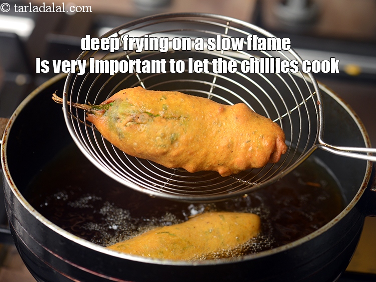 Step 29 – Deep frying on a slow flame is very important to let the chillies cook. But …