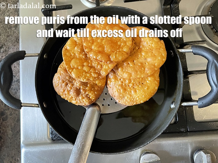 Step 27 – Remove the puris from the oil with a slotted spoon and wait a bit till …
