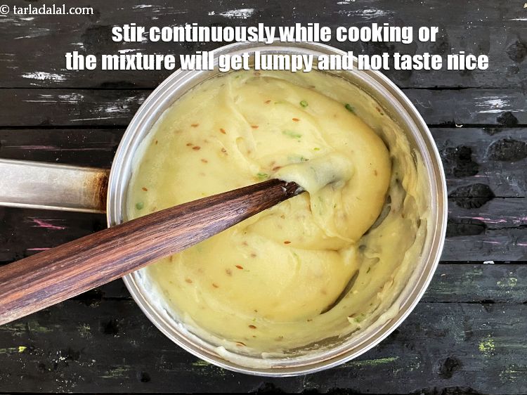 Step 32 – <strong>You must continuously stir while making khichu.&nbsp;</strong>Otherwise you are going to have a lumpy mixture …