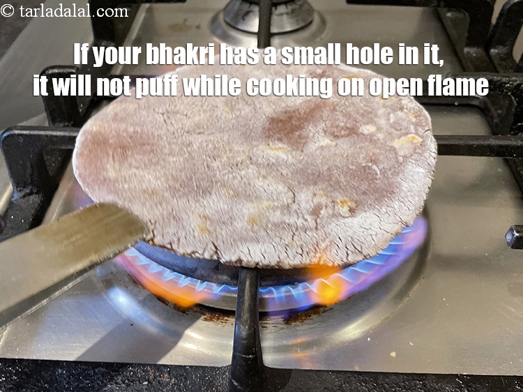 Step 27 – If your bhakri has a small hole in it, it will not puff while cooking …
