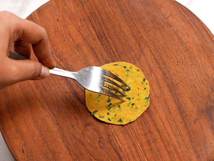 Step 20 – Make sure you prick holes all over the puri so that they don't rise when …