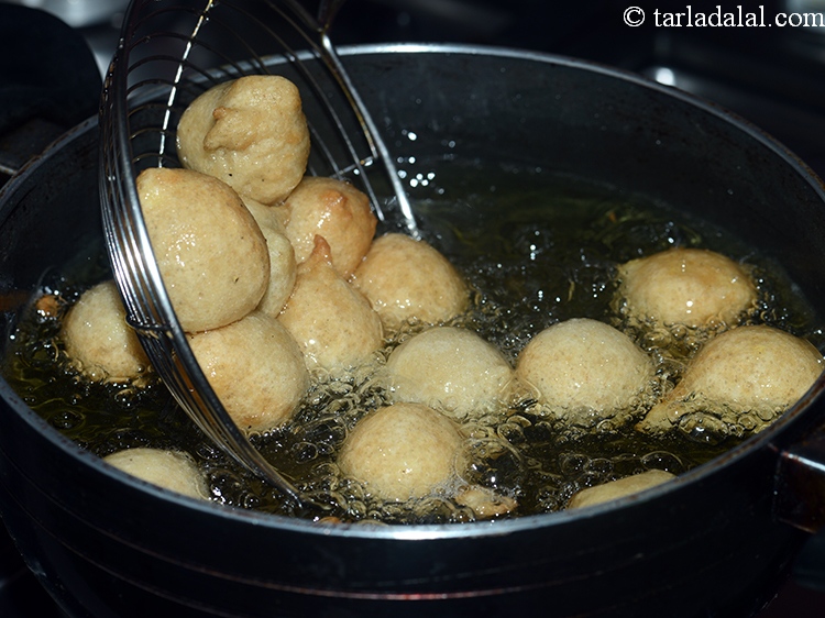 Step 19 – It is very important to fry the gulgulas slowly on medium flame till they are …