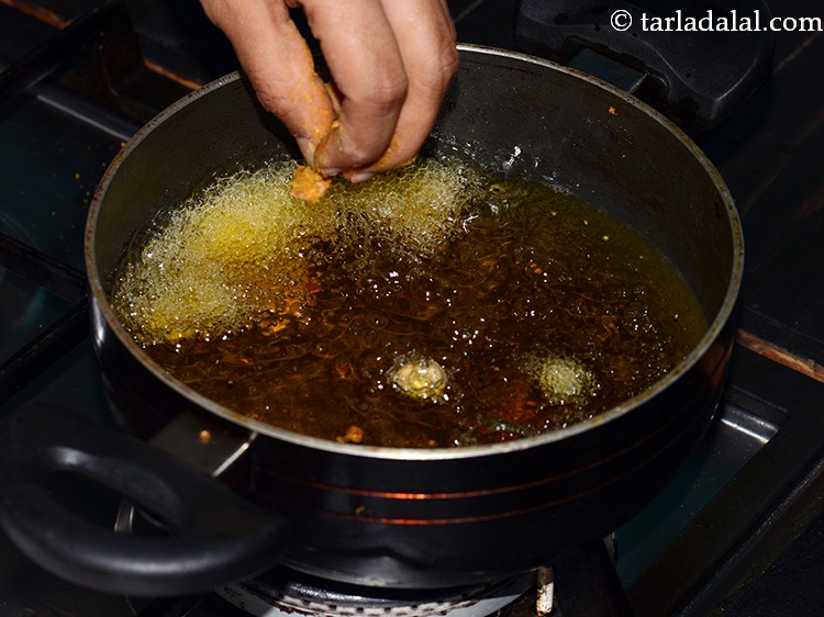 Step 24 – Add peanuts slowly slowly in hot oil, be careful as you may burn yourself as …