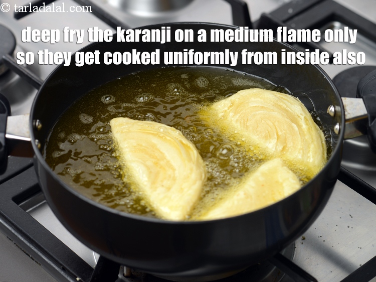 Step 56 – Deep fry the karanji on a medium flame only so they get cooked uniformly from …