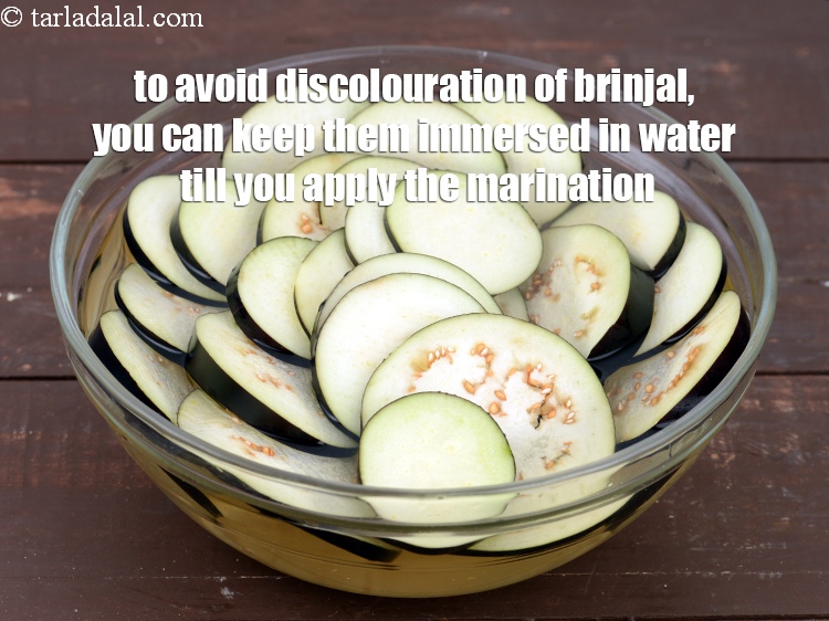 Step 38 – To avoid discolouration of brinjal, you can keep them immersed in water till you apply …