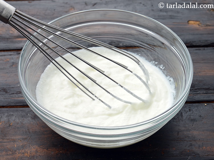 Step 25 – For the curd dip, add 3/4 cup&nbsp;<a href="https://www.tarladalal.com/glossary-thick-curds-2097i">thick curds (dahi)</a>&nbsp;in a bowl. Whisk it well.&nbsp;