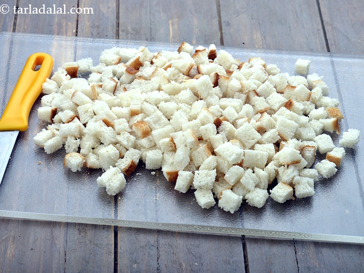 Step 4 – Cut the bread slices into very small cubes using a sharp knife. You can cut …
