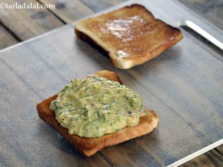 Step 17 – Spread a portion of the mixture evenly on one buttered bread slice. This can be …