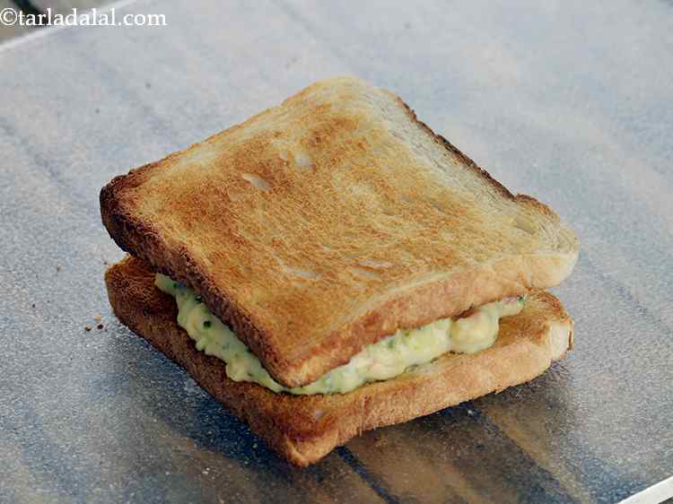 Step 18 – Cover this using the other buttered bread side facing downwards and press it lightly. If …