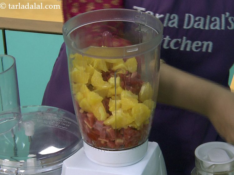 Step 4 – Then add orange segments. Here we have cut them into halves for ease of blending.&nbsp;