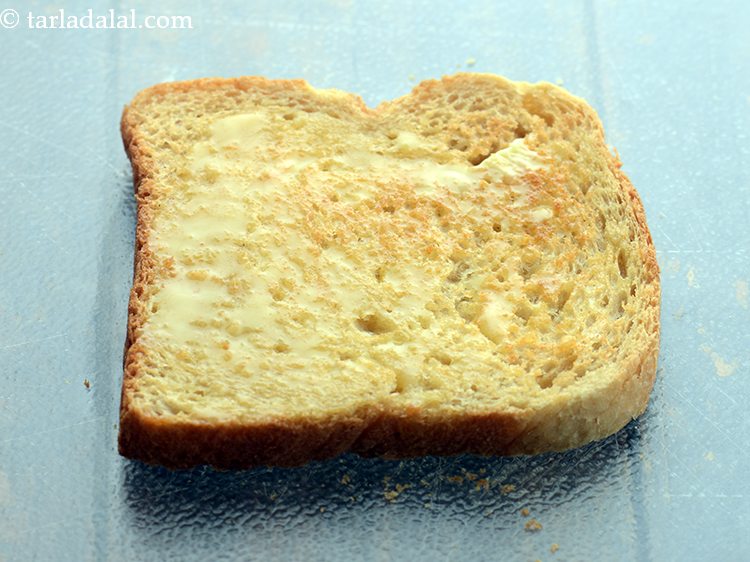 Step 12 – Apply &frac14; tsp of butter evenly over it.