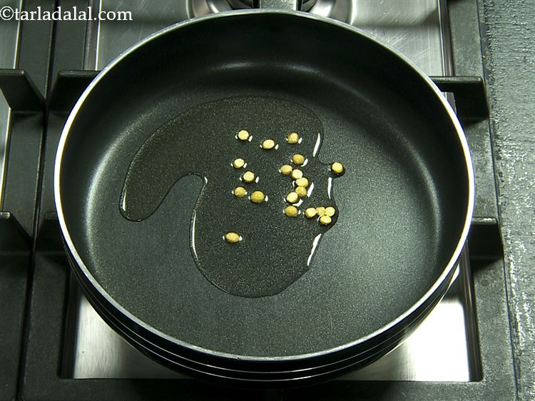 Step 4 – Add the chana dal. When toasted, they provide a crunchy mouthfeel to the chutney.