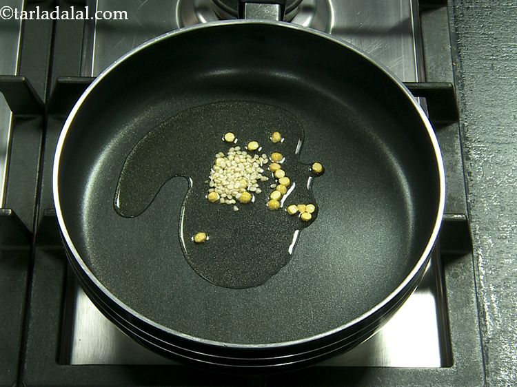 Step 5 – Add the urad dal. They provide a unique flavour to the South-Indian <strong>tomato coconut chutney</strong>.