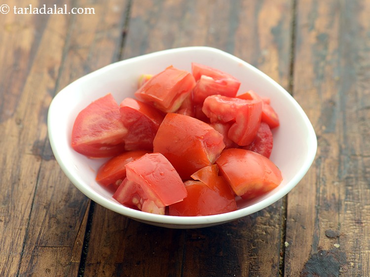 Step 25 – Add 1/2 cup&nbsp;deseeded&nbsp;<a href="https://www.tarladalal.com/glossary-tomato-cubes-728i">tomato cubes</a>.