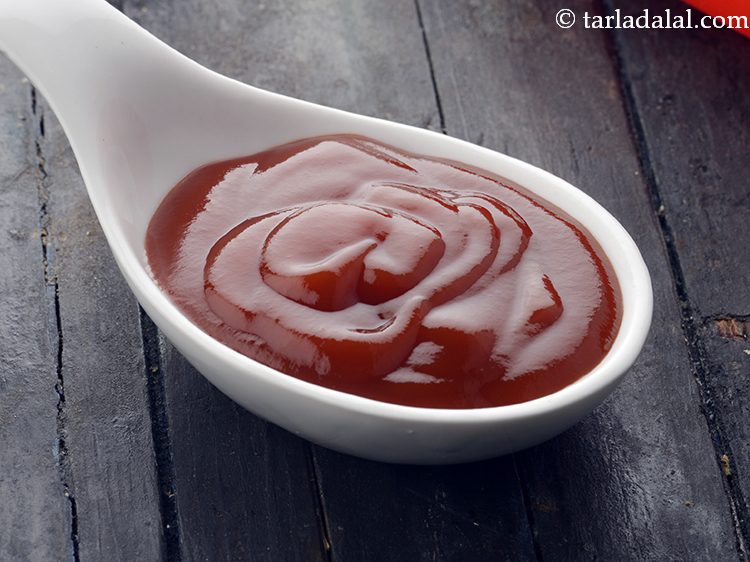 Step 30 – Spread 2 tsp <a href="https://www.tarladalal.com/glossary-tomato-ketchup-tomato-sauce-181i">tomato ketchup</a>&nbsp;over it.