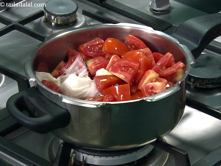 Step 12 – Add the prepared potli and push it right inside so the flavours are distributed well.