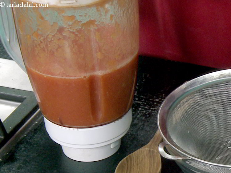 Step 15 – Cool the tomato mixture slightly and blend it in a mixer till smooth.