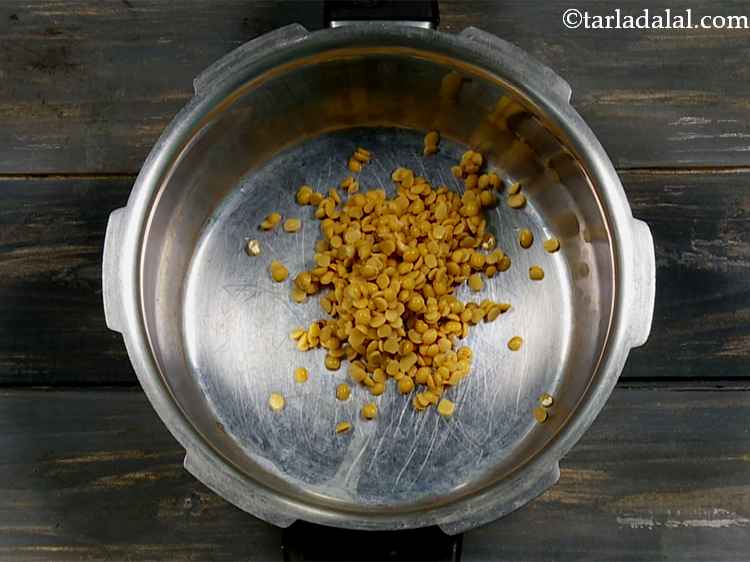 Step 10 – Put the washed and drained toovar dal in a pressure cooker.
