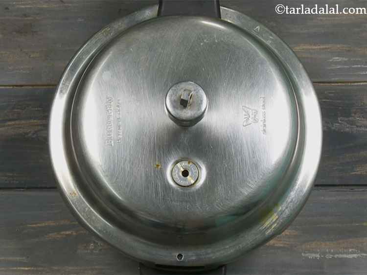 Step 12 – Shut the lid and pressure cook the dal for 4 whistles. The dal will become …