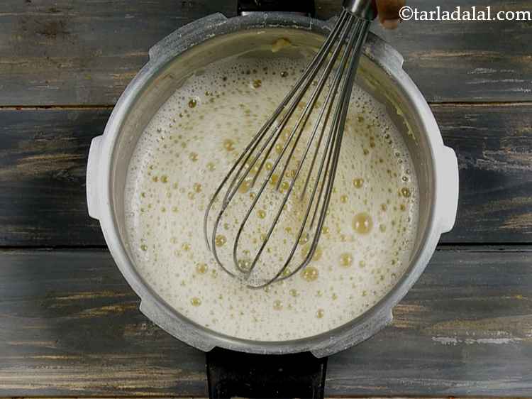 Step 14 – Whisk the dal thoroughly till smooth. You can even use a hand blender to make …