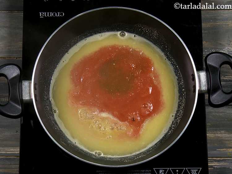 Step 17 – Also add the tamarind water. Both these ingredients are the ones that give the tomatoes …