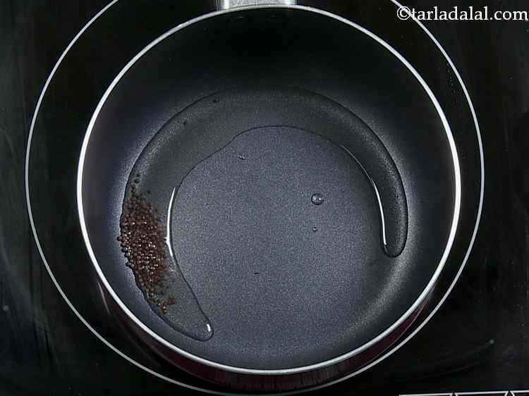 Step 22 – Meanwhile, for the tempering, heat the oil in a small non-stick pan and add the …