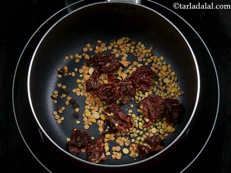 Step 5 – Add the peppercorns as well. Both the red chillies and pepper give a smoky, spicy …