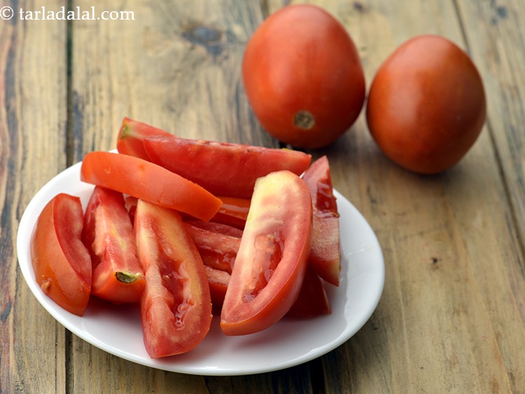 Step 3 – Next make segments of tomatoes also and add them to the juicer (hopper) a few …