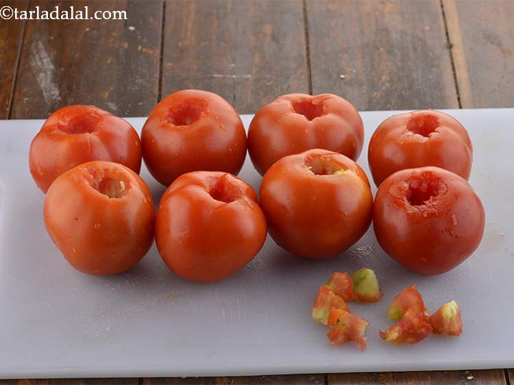Step 4 – Scoop out and discard the eyes of the tomatoes using the tip of the sharp …