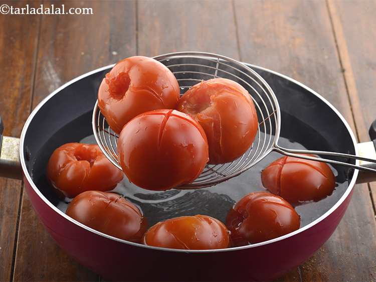 Step 7 – Using a slotted spoon, remove the tomatoes.