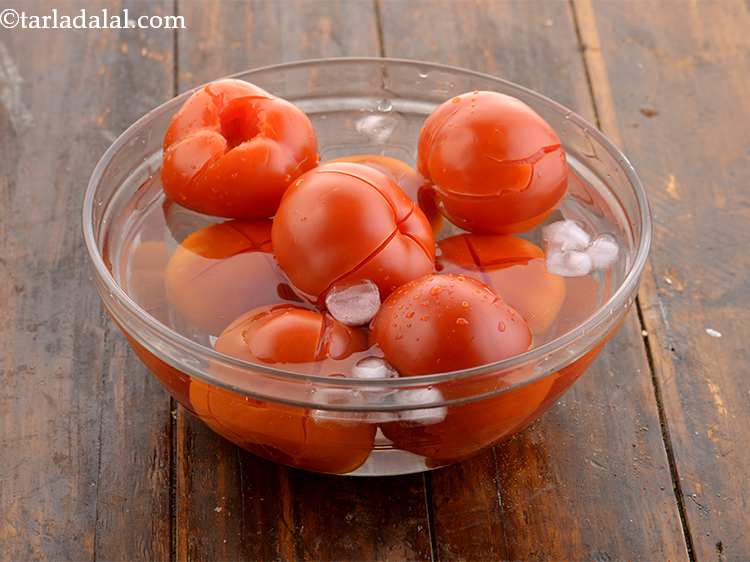 Step 8 – Put in cold water for some time. The refreshing of tomatoes by adding them in …
