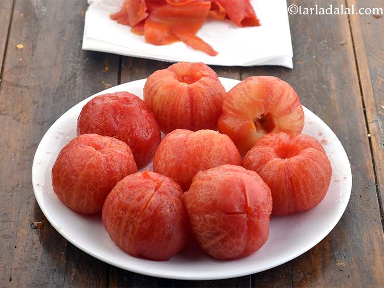 Step 9 – When the tomatoes are cool, peel and discard the skin. Start peeling from the cut …