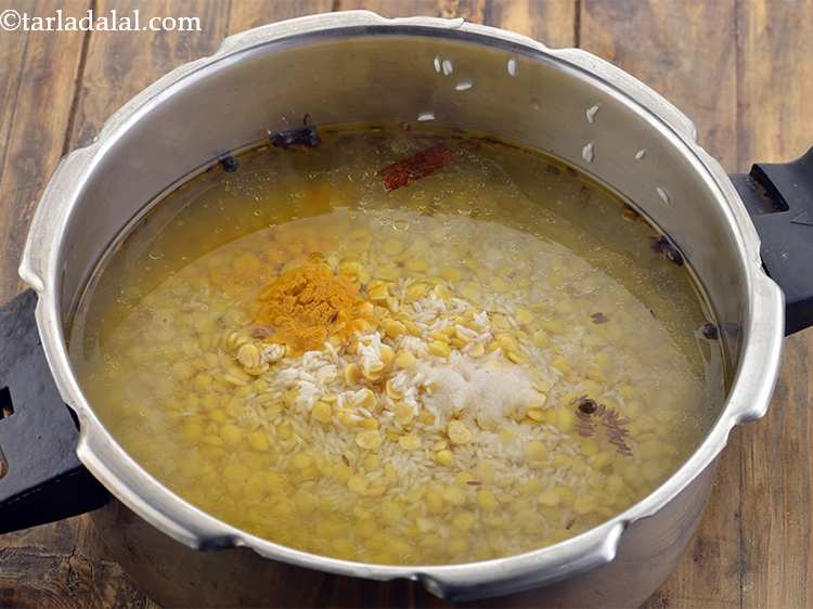 Step 9 – Add the turmeric powder and salt.