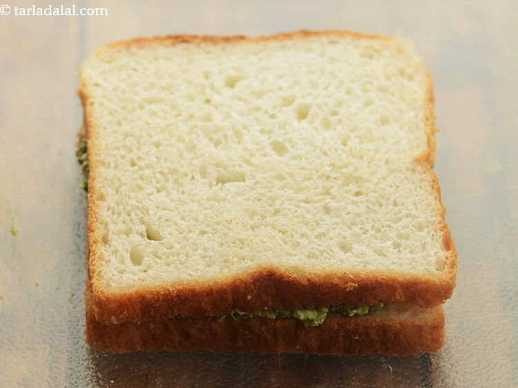 Step 11 – Place another bread slice with the buttered side facing downwards.&nbsp;