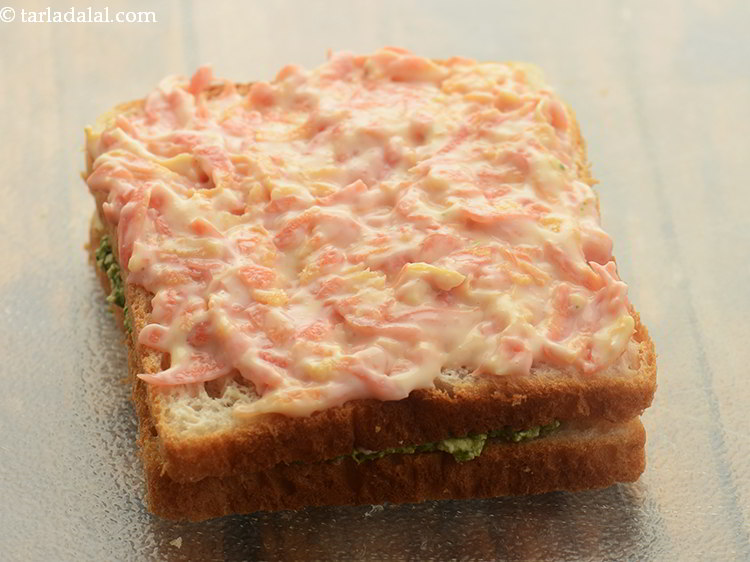 Step 12 – Spread the orange mixture evenly over it.&nbsp;