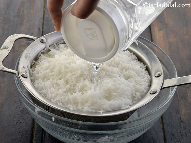 Step 21 – Pour some cold water on the rice to stop further cooking. Let all the water …