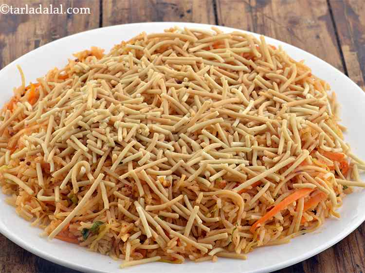 Step 56 – Now put the 3/4th cup of the crispy fried noodles on top of the rice.&nbsp;You …