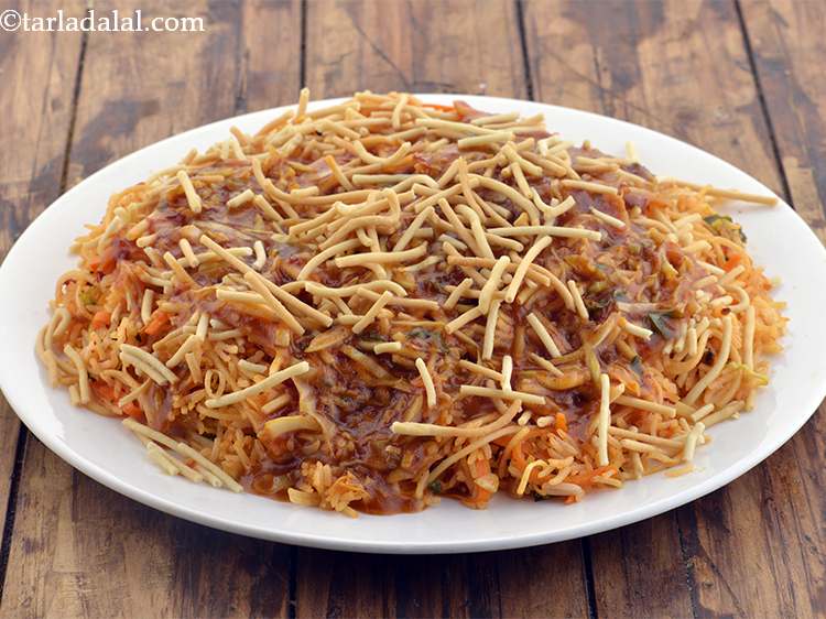 Step 58 – Finally, sprinkle the remainig 1/4th cup of the crispy fried noodles.