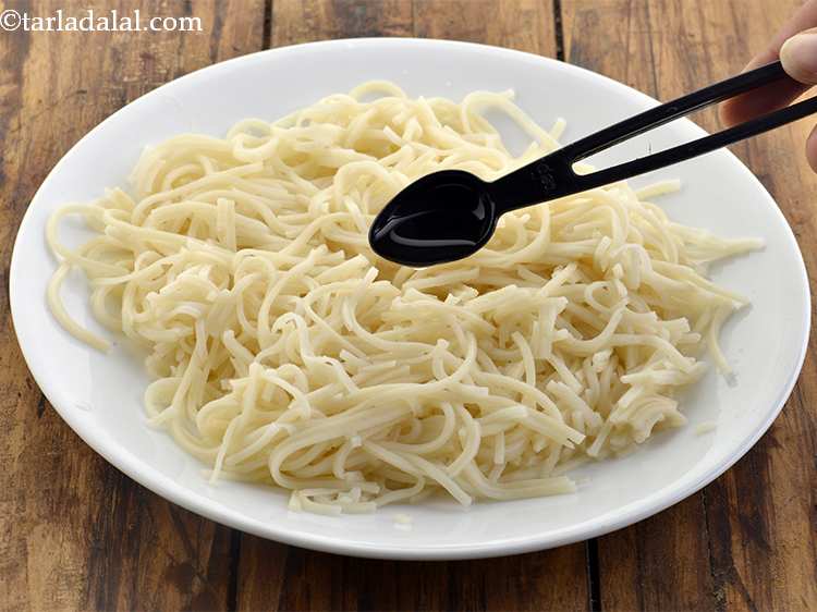 Step 9 – Drizzle 1/2 tsp of oil over the noodles to prevent sticking.