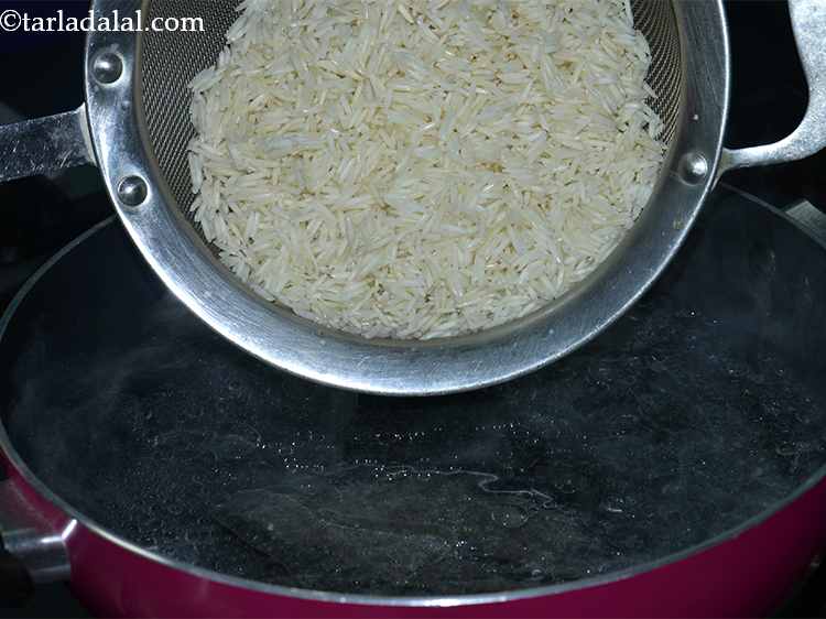 Step 18 – Add the rice to the boiling water and mix well.