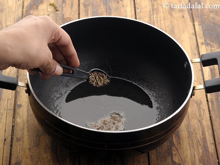 Step 17 – Once the oil is hot, add the cumin seeds.