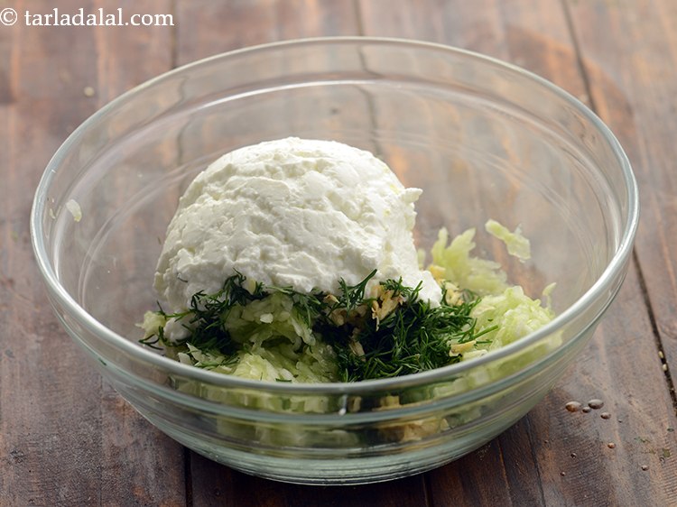 Step 9 – Add <a href="https://www.tarladalal.com/How-To-Make-Hung-Curd-42765r" target="_blank">hung curds</a>.