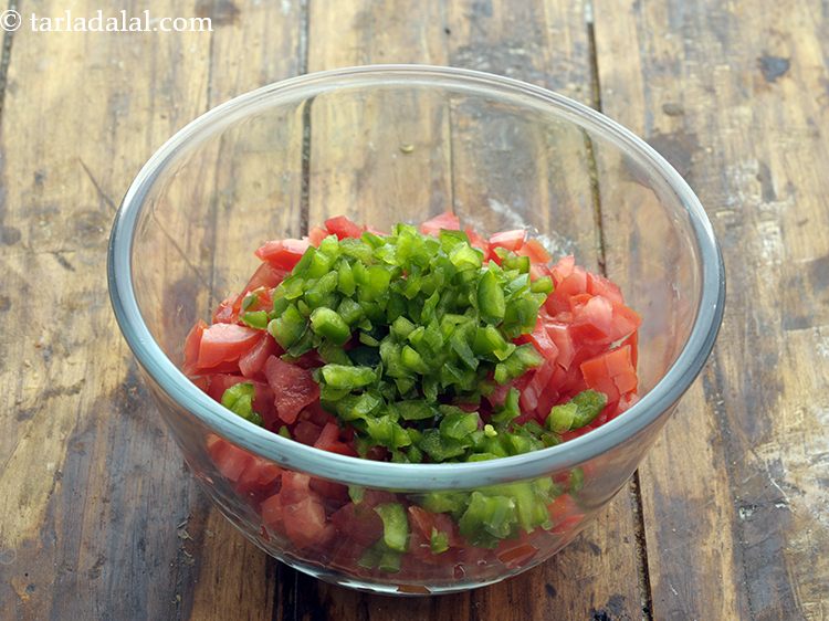 Step 103 – Add 2 tbsp&nbsp;finely&nbsp;<a href="https://www.tarladalal.com/glossary-chopped-capsicum-164i">chopped capsicum</a>.&nbsp;