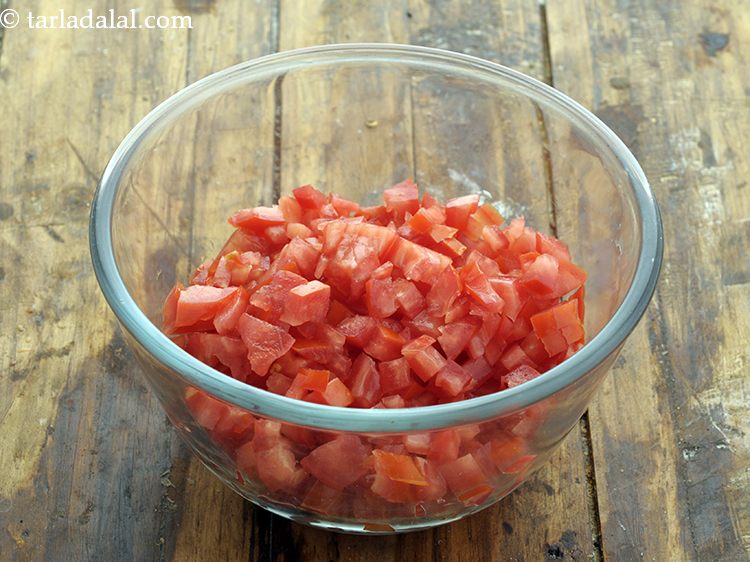 Step 102 – In a deep glass bowl put&nbsp;1 cup&nbsp;deseeded and finely&nbsp;<a href="https://www.tarladalal.com/glossary-chopped-tomatoes-779i">chopped tomatoes</a>.