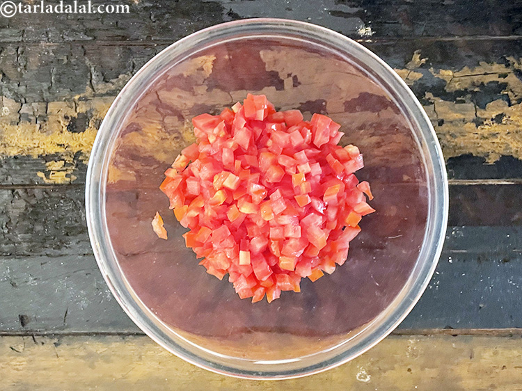 Step 70 – In a deep glass bowl put&nbsp;1 cup&nbsp;deseeded and finely&nbsp;<a href="https://www.tarladalal.com/glossary-chopped-tomatoes-779i">chopped tomatoes</a>.